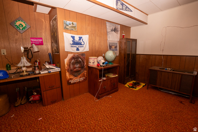 160 North 100 W Street Beaver, UT 84713 - Photo 32 of 36 Carpeted home office featuring wood walls and a wainscoted wall