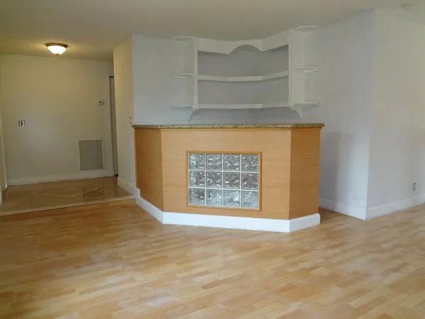 a view of an empty room with a window