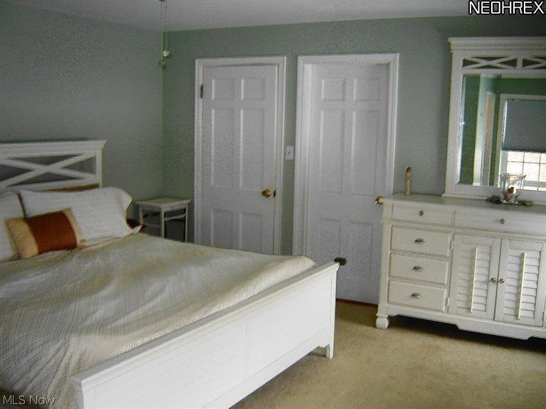 4048 Conover Road University Heights, OH 44118 - Photo 16 of 24 Serene master bedroom features a fully renovated en suite bath and a walk-in closet!