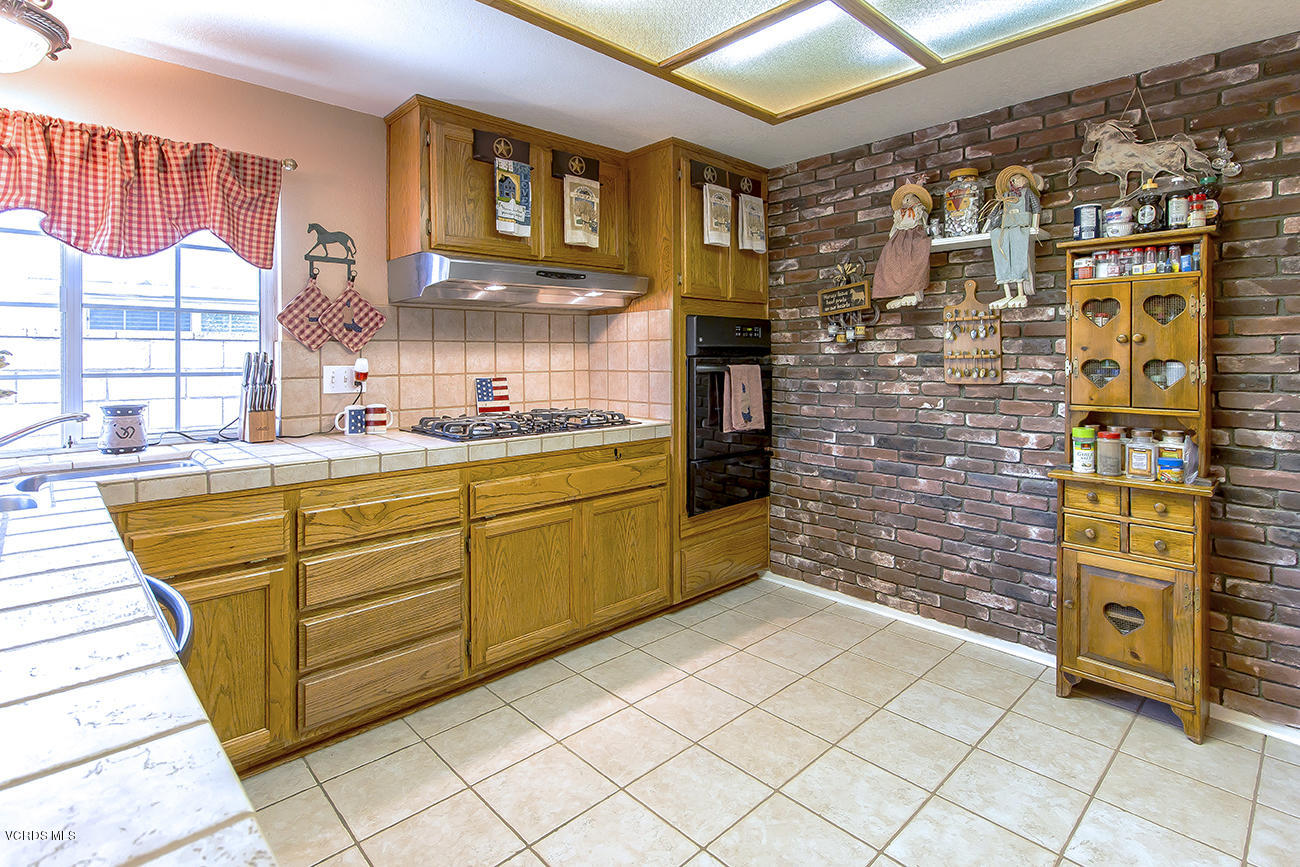 2942 Racine Street Simi Valley, CA 93065 - Photo 14 of 37 a kitchen with cabinets and window