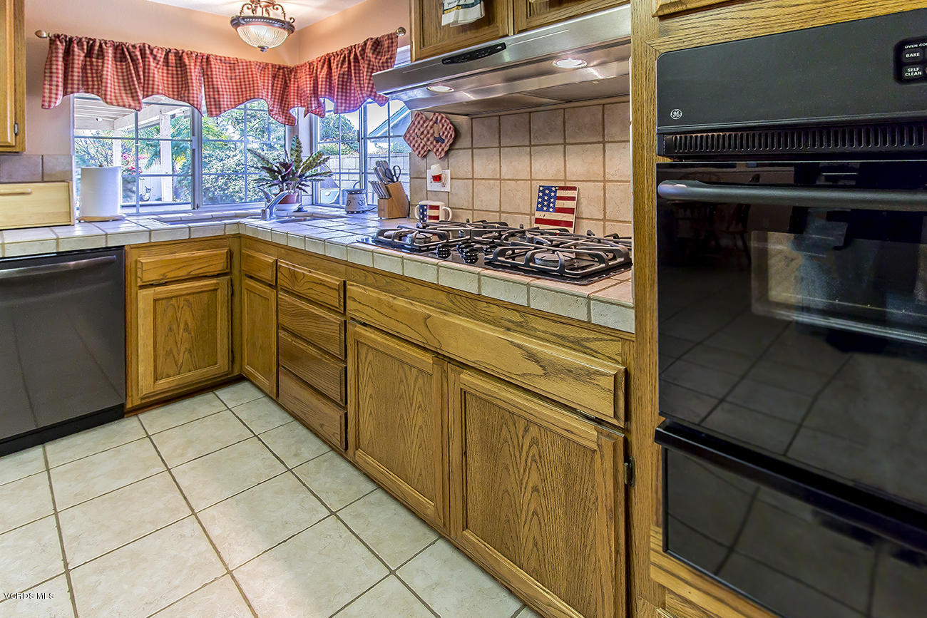 2942 Racine Street Simi Valley, CA 93065 - Photo 17 of 37 a kitchen with stainless steel appliances a stove and more cabinets