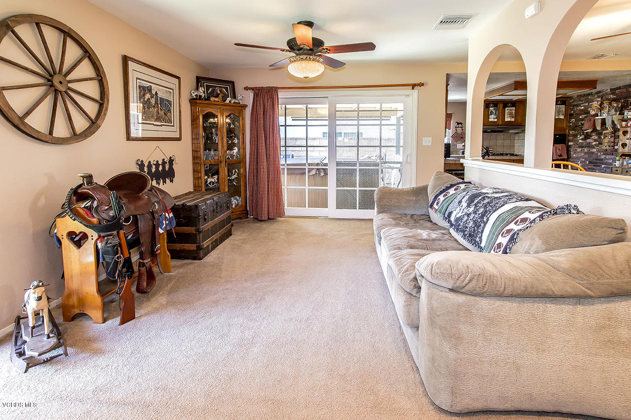 2942 Racine Street Simi Valley, CA 93065 - Photo 18 of 37 a living room with furniture gym equipment and a large window