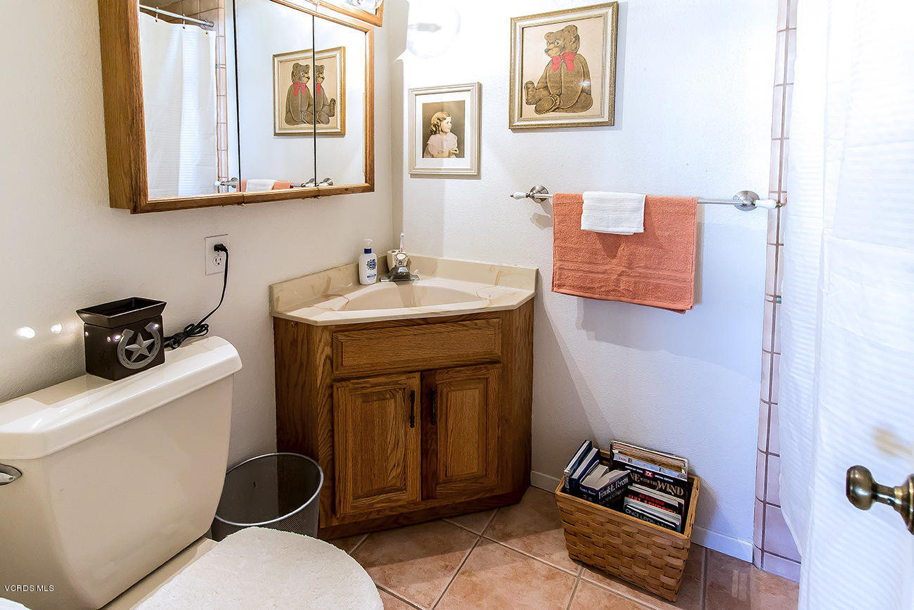 2942 Racine Street Simi Valley, CA 93065 - Photo 23 of 37 a bathroom with a toilet a sink and mirror