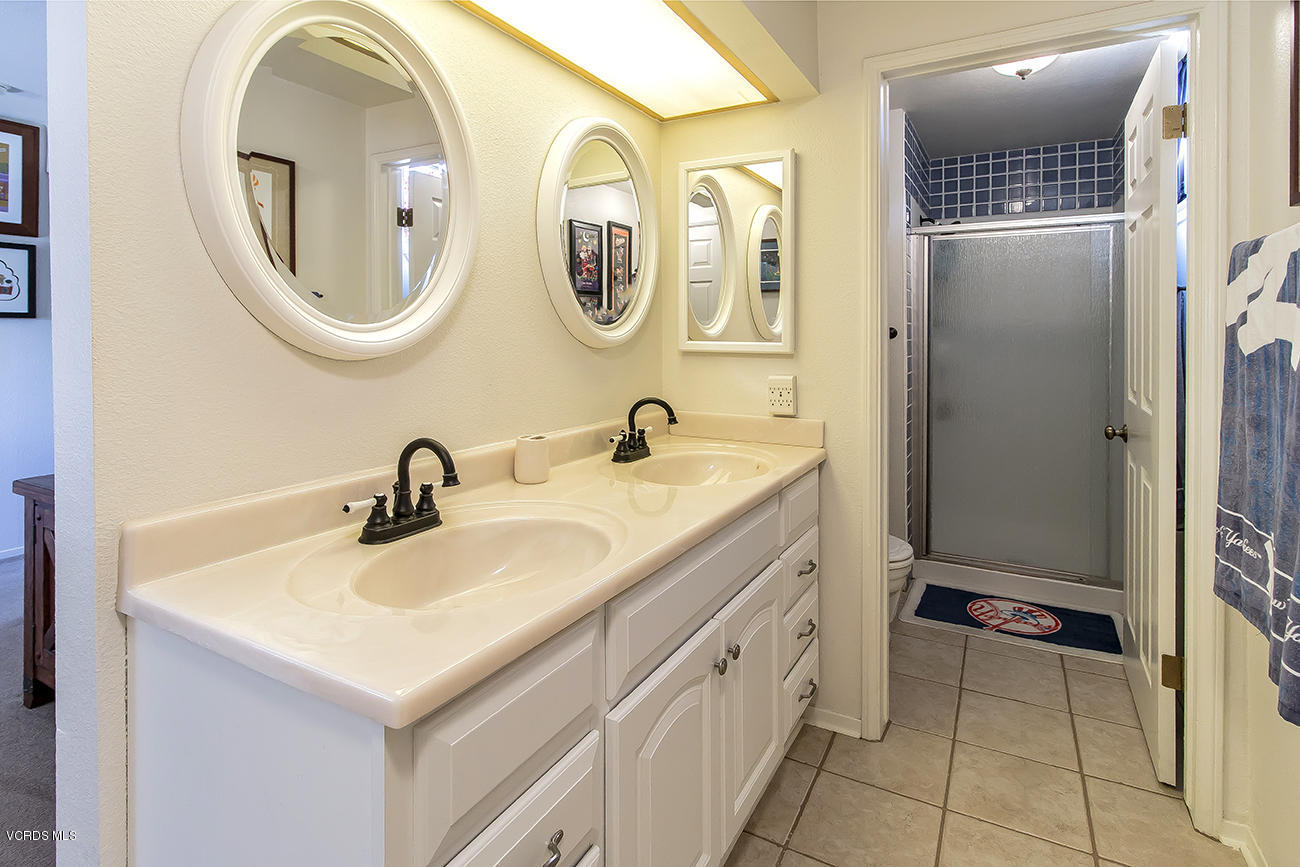 2942 Racine Street Simi Valley, CA 93065 - Photo 27 of 37 a bathroom with a sink and a mirror