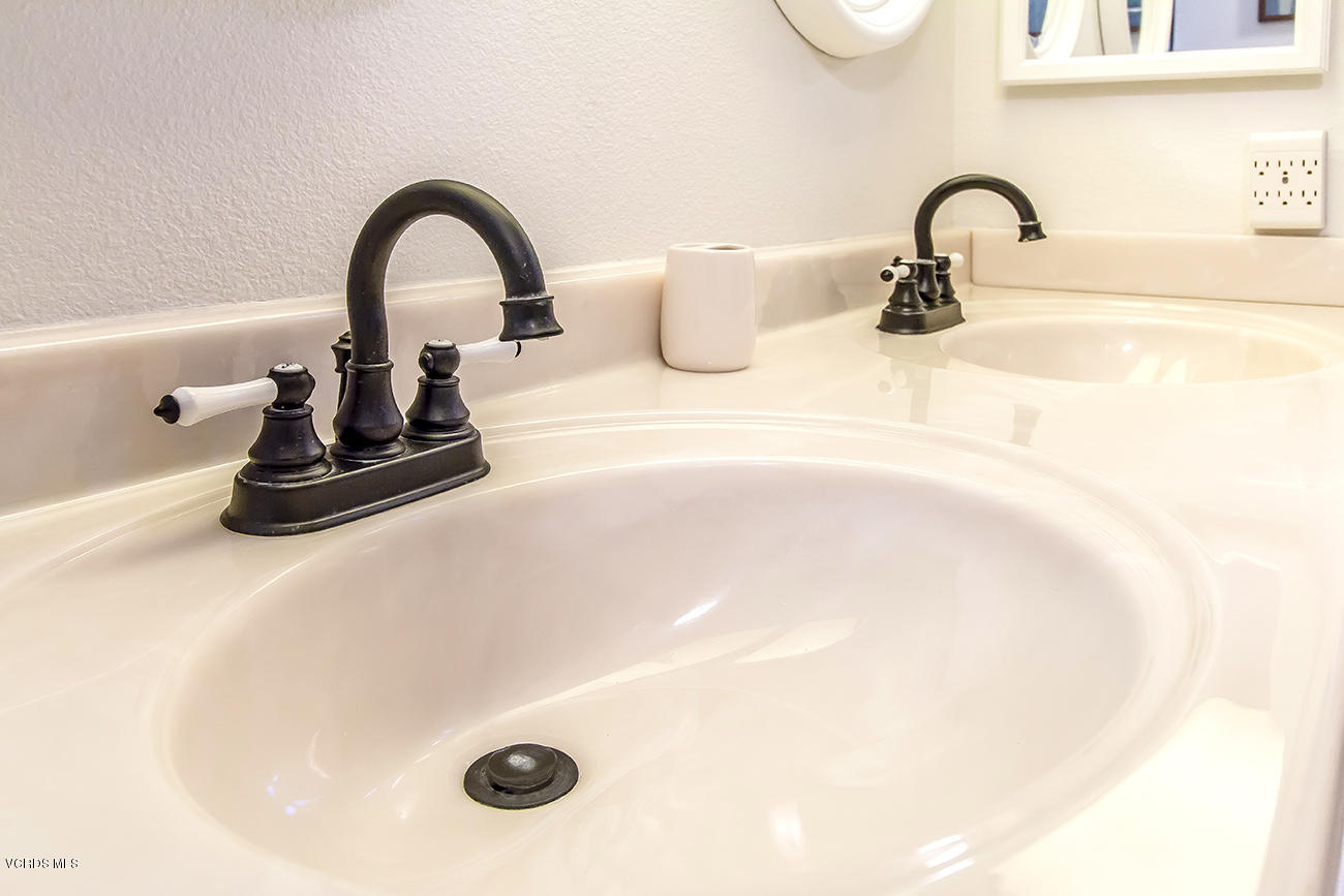 2942 Racine Street Simi Valley, CA 93065 - Photo 28 of 37 a close view of a faucet a sink and a faucet