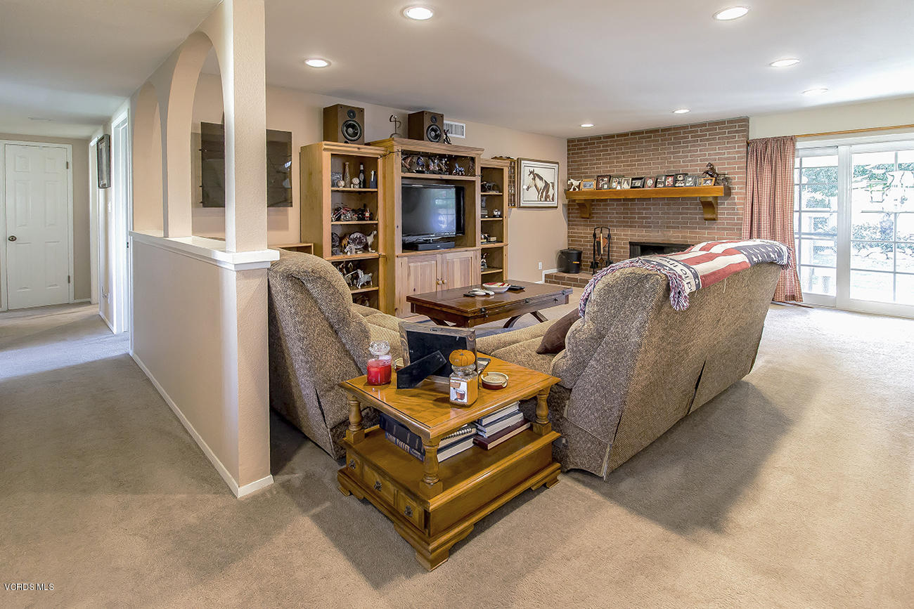 2942 Racine Street Simi Valley, CA 93065 - Photo 7 of 37 a living room with furniture a flat screen tv and a refrigerator
