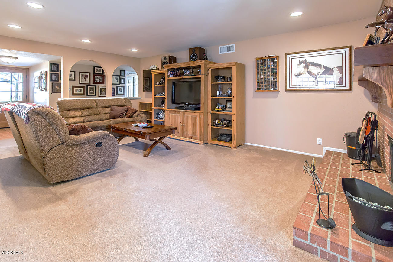 2942 Racine Street Simi Valley, CA 93065 - Photo 9 of 37 a living room with furniture kitchen view and a flat screen tv