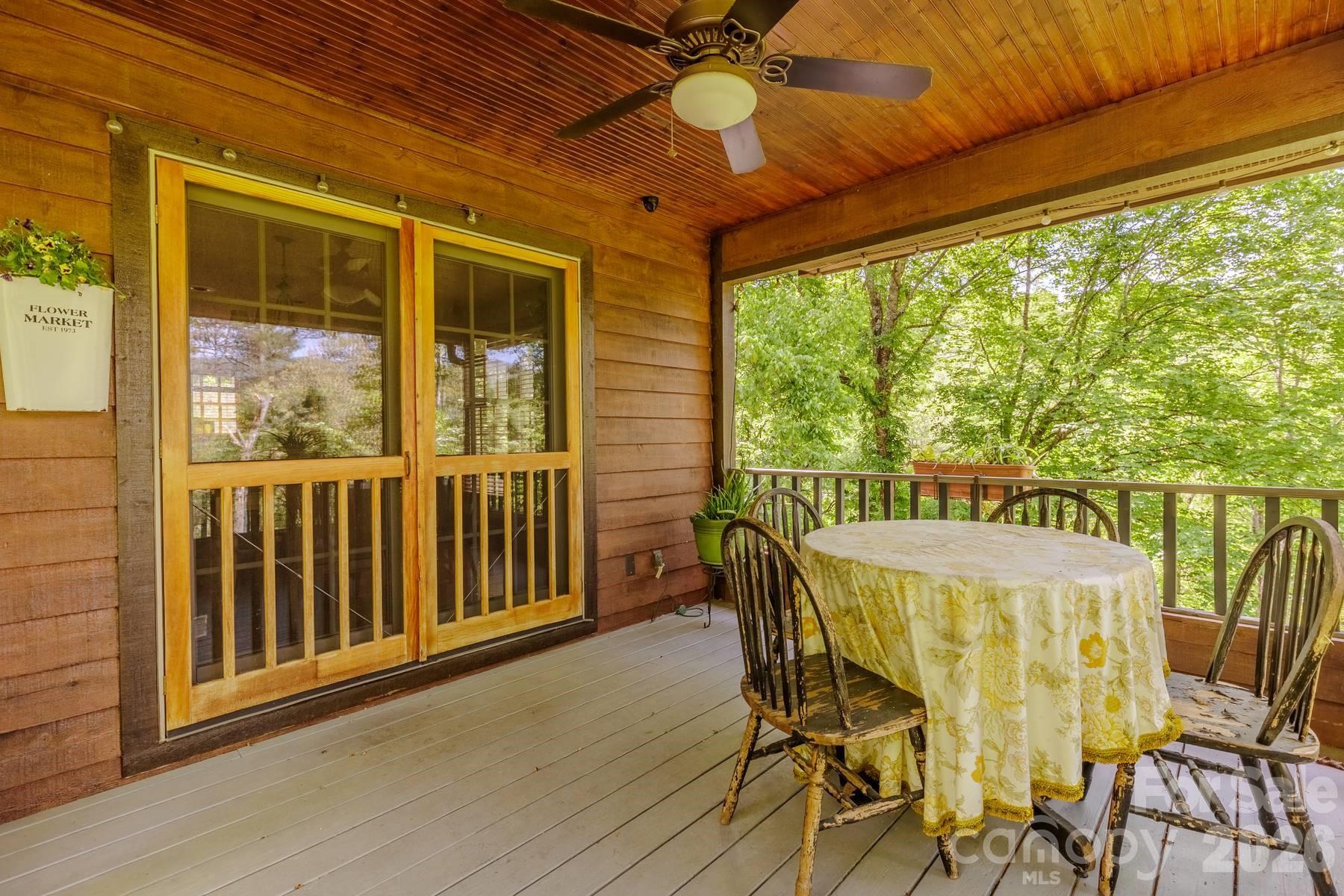97 Covered Bridge Road Robbinsville, NC 28771 - Photo 11 of 45 a view of a dining room with furniture window and outside view