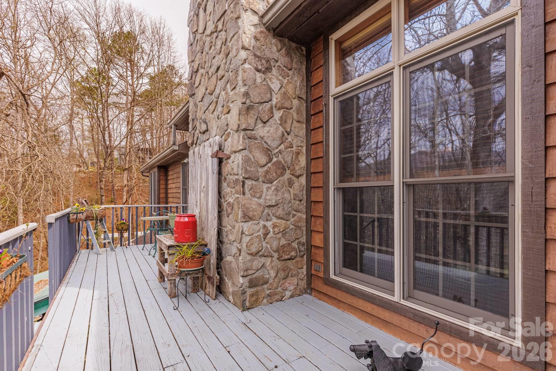 97 Covered Bridge Road Robbinsville, NC 28771 - Photo 14 of 45 a balcony view with a seating space