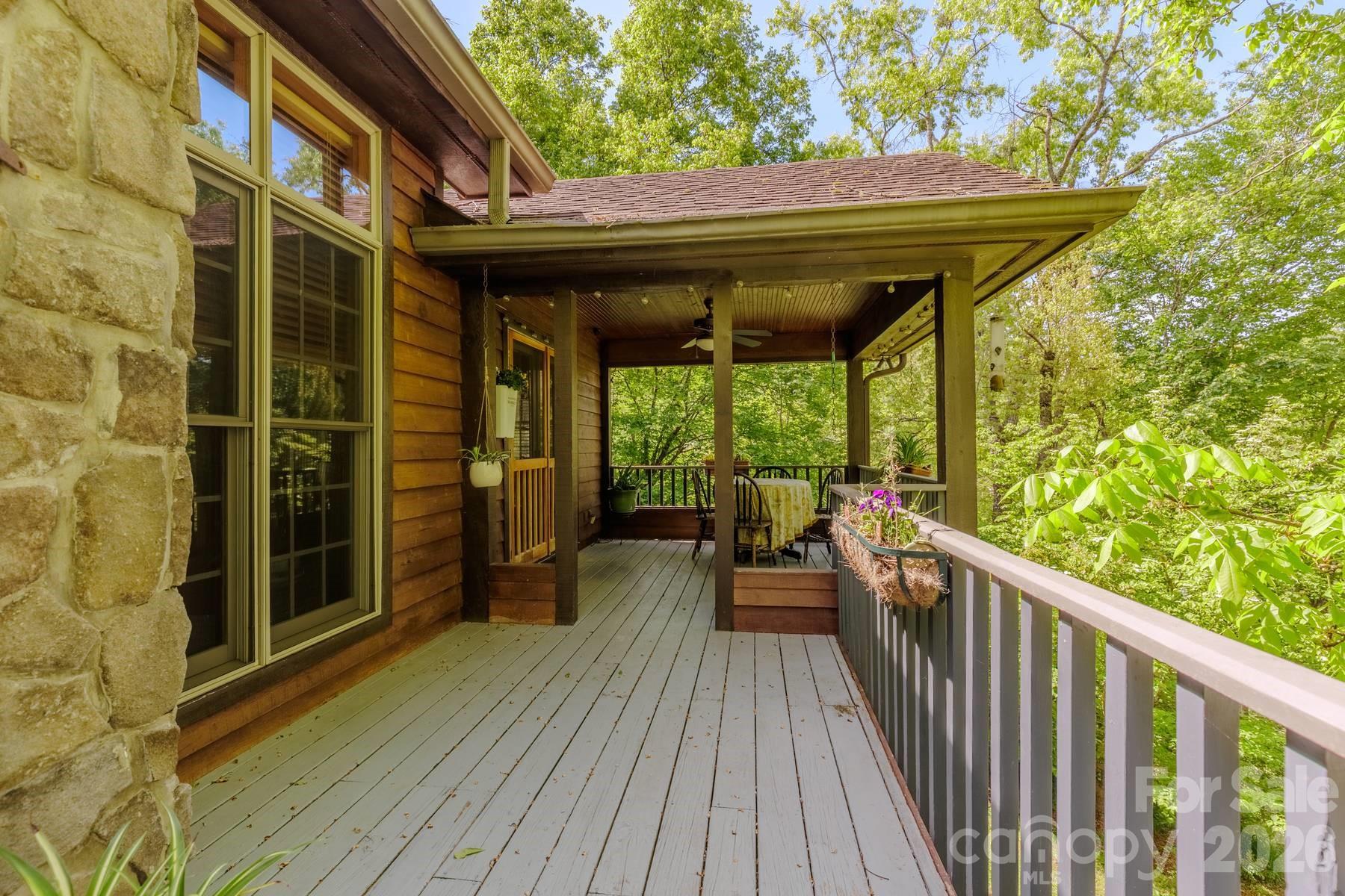 97 Covered Bridge Road Robbinsville, NC 28771 - Photo 16 of 45 a view of a balcony with wooden floor