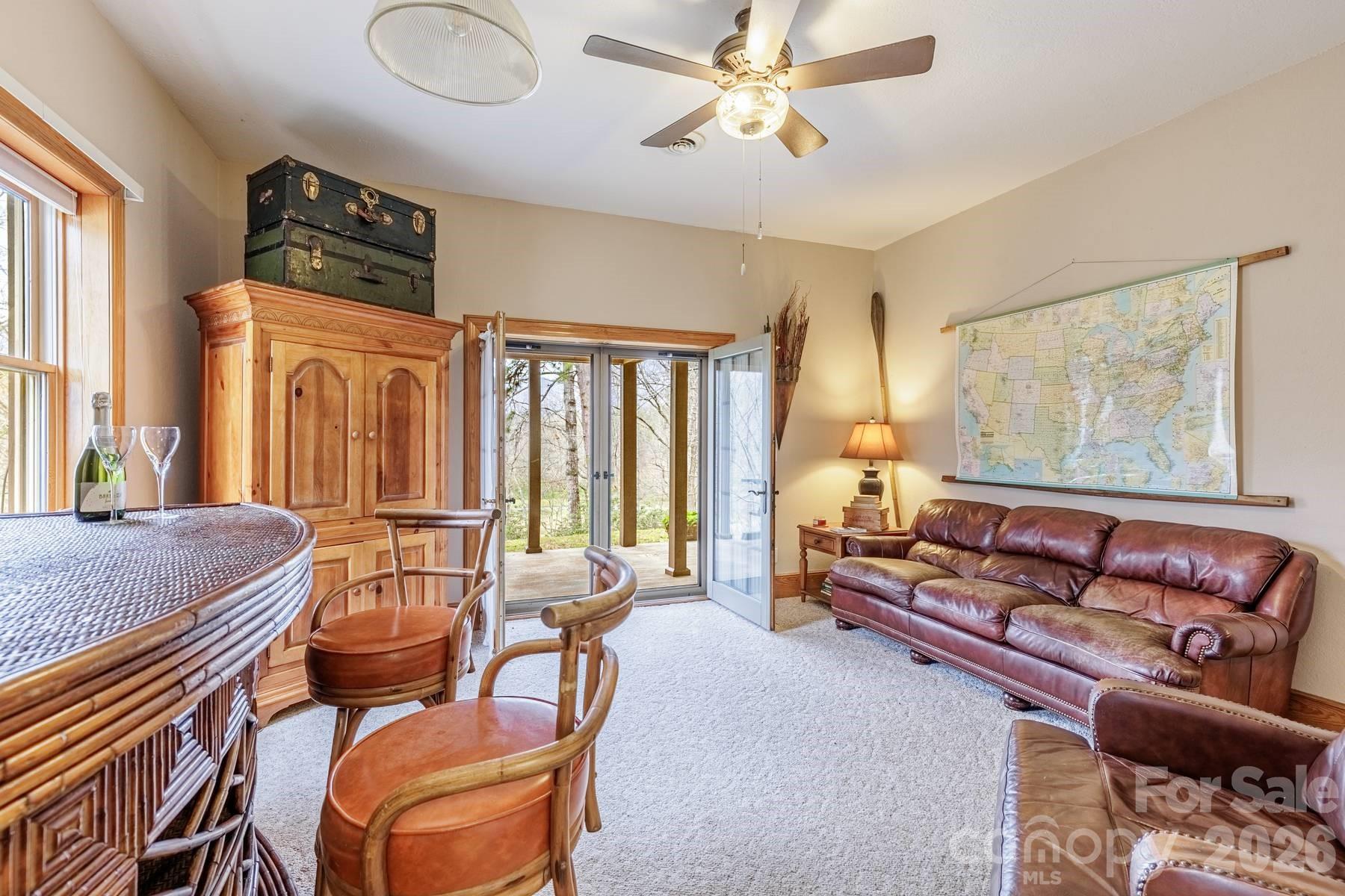 97 Covered Bridge Road Robbinsville, NC 28771 - Photo 28 of 45 a living room with furniture and a large window