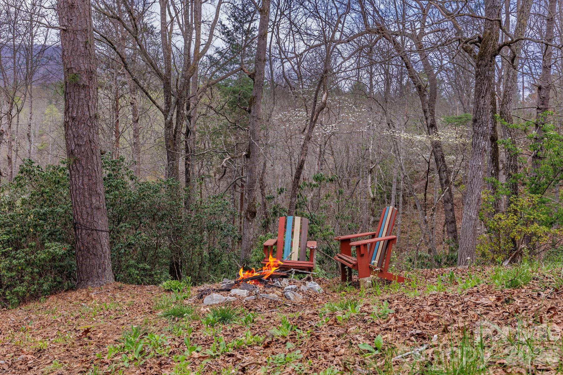 97 Covered Bridge Road Robbinsville, NC 28771 - Photo 39 of 45 a backyard of a house with seating space