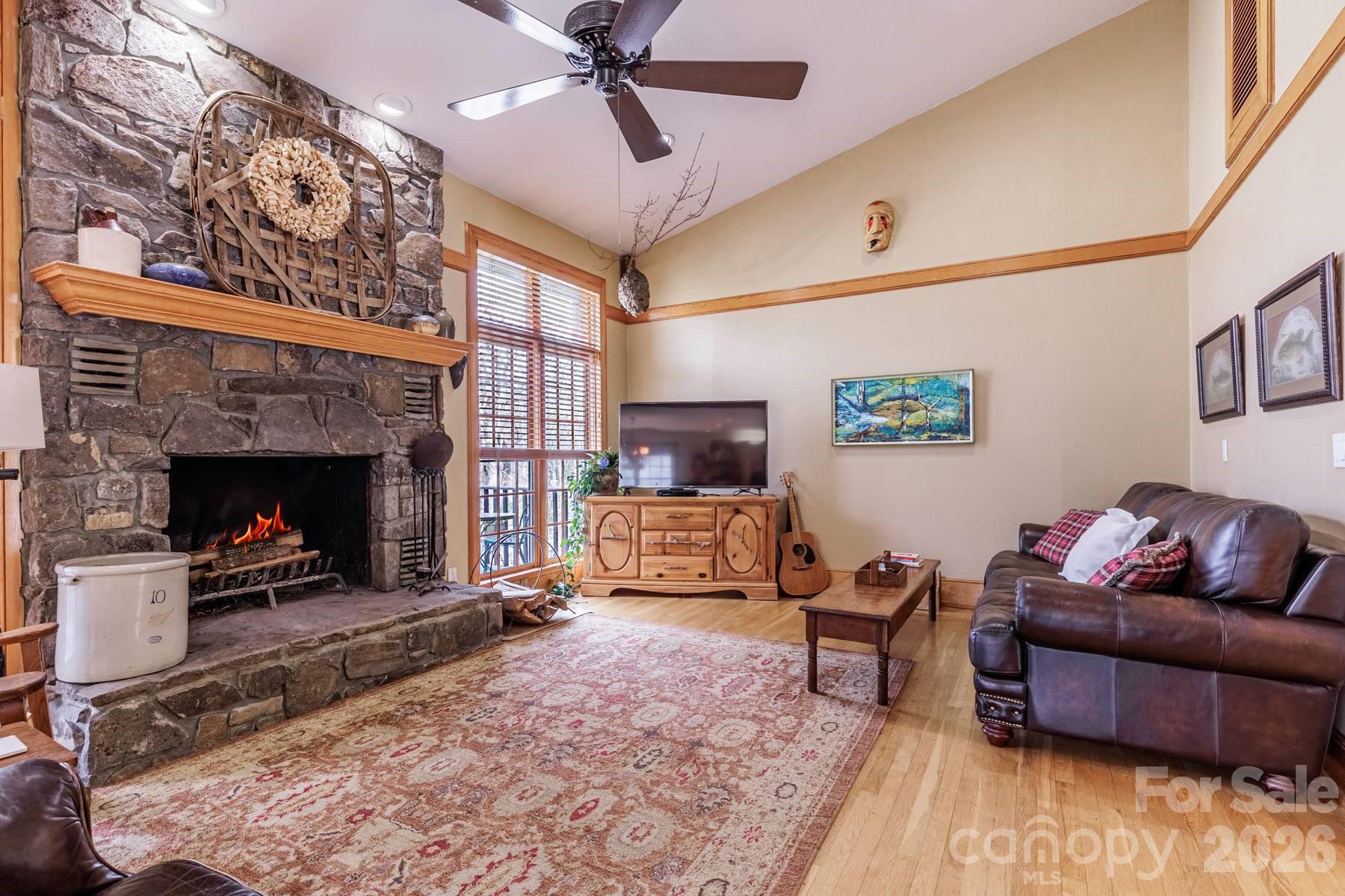 97 Covered Bridge Road Robbinsville, NC 28771 - Photo 4 of 45 a living room with furniture and a fireplace