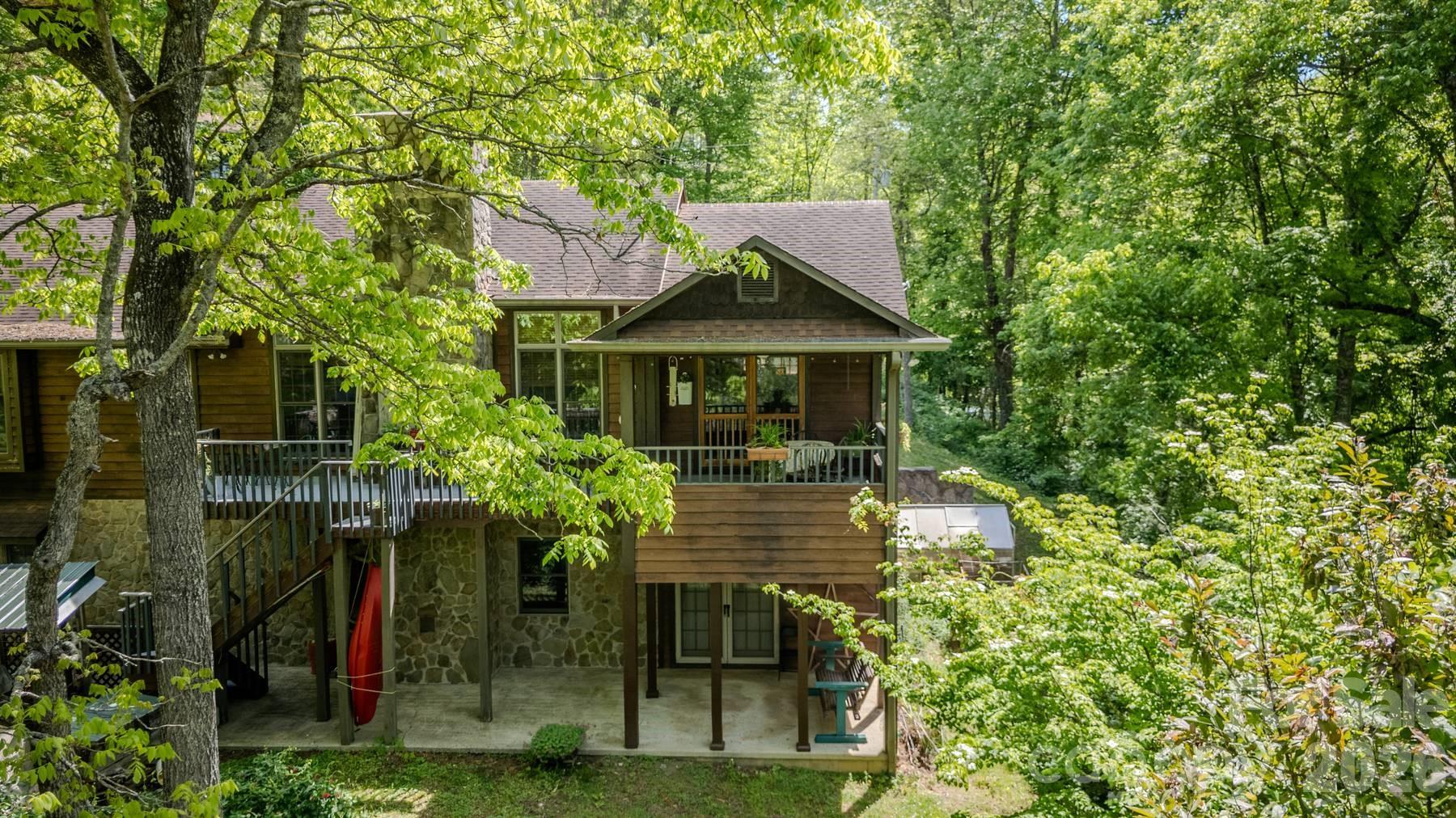 97 Covered Bridge Road Robbinsville, NC 28771 - Photo 44 of 45 a front view of a house with a yard