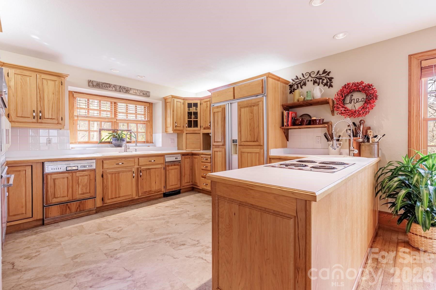 97 Covered Bridge Road Robbinsville, NC 28771 - Photo 7 of 45 a kitchen with a sink stove and refrigerator