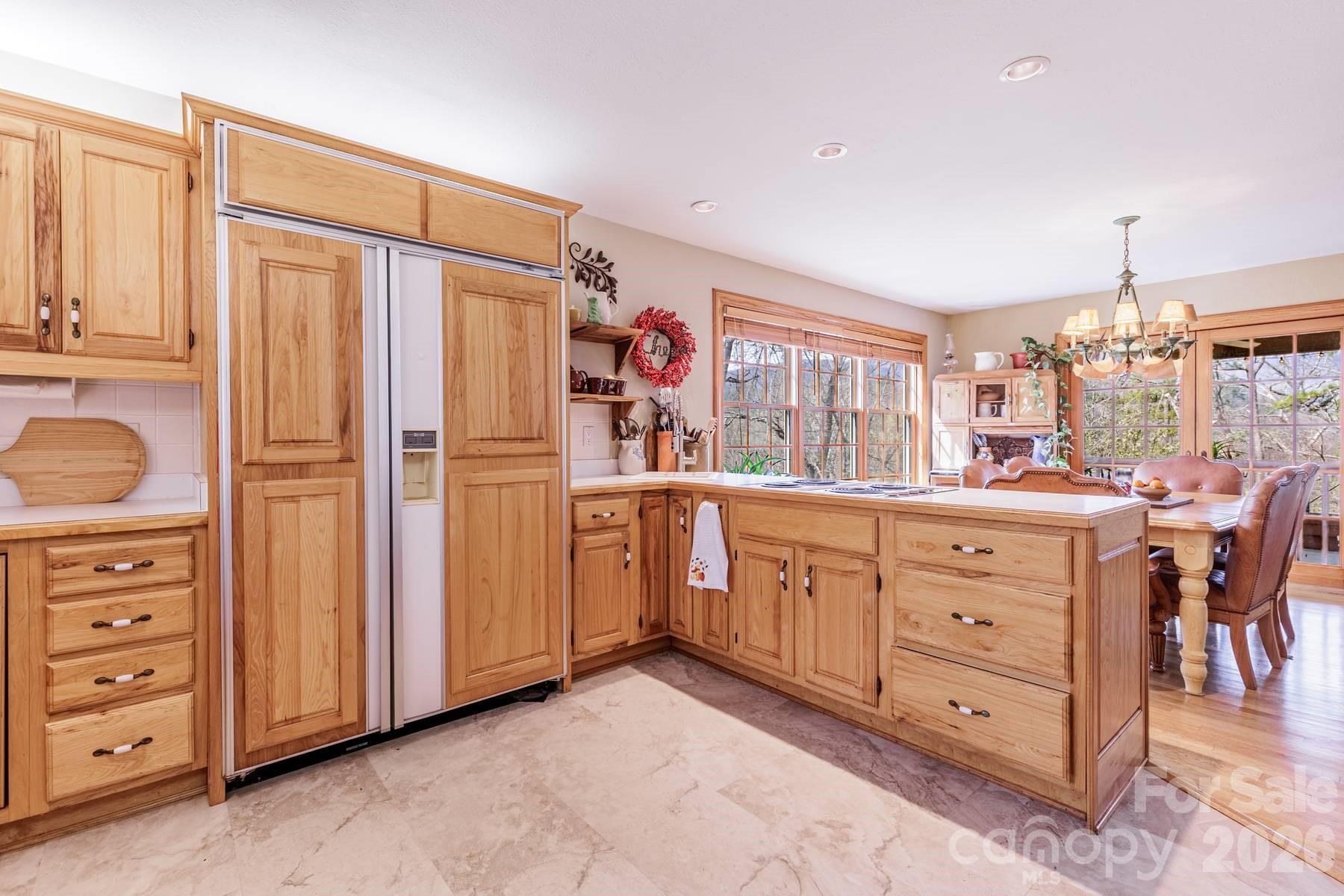 97 Covered Bridge Road Robbinsville, NC 28771 - Photo 10 of 45 a kitchen with cabinets appliances and a counter top