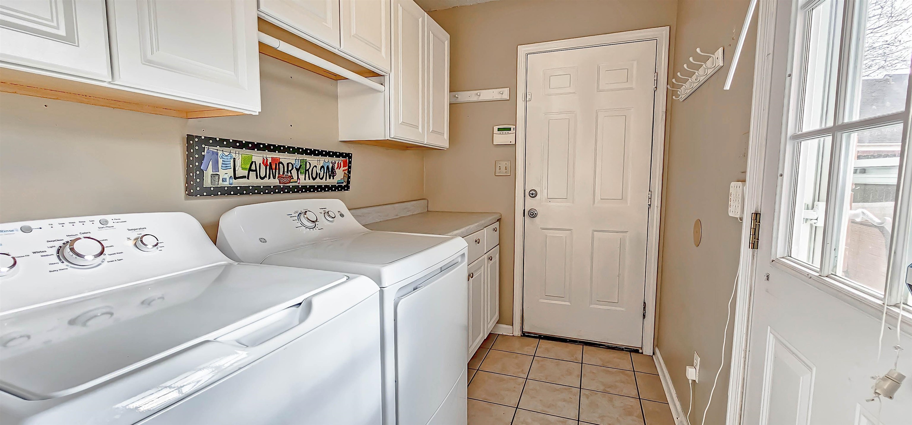 251 Summit View Cove Collierville, TN 38017 - Photo 11 of 30 a utility room with dryer and washer