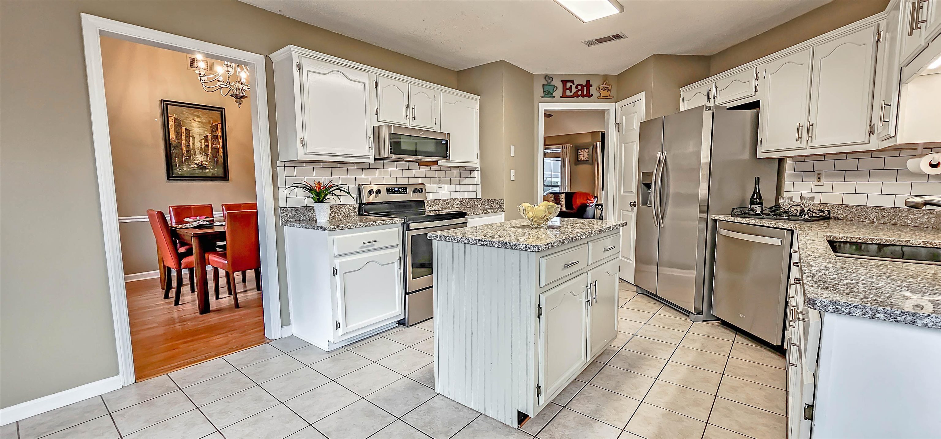 251 Summit View Cove Collierville, TN 38017 - Photo 14 of 30 a kitchen with white cabinets and appliances
