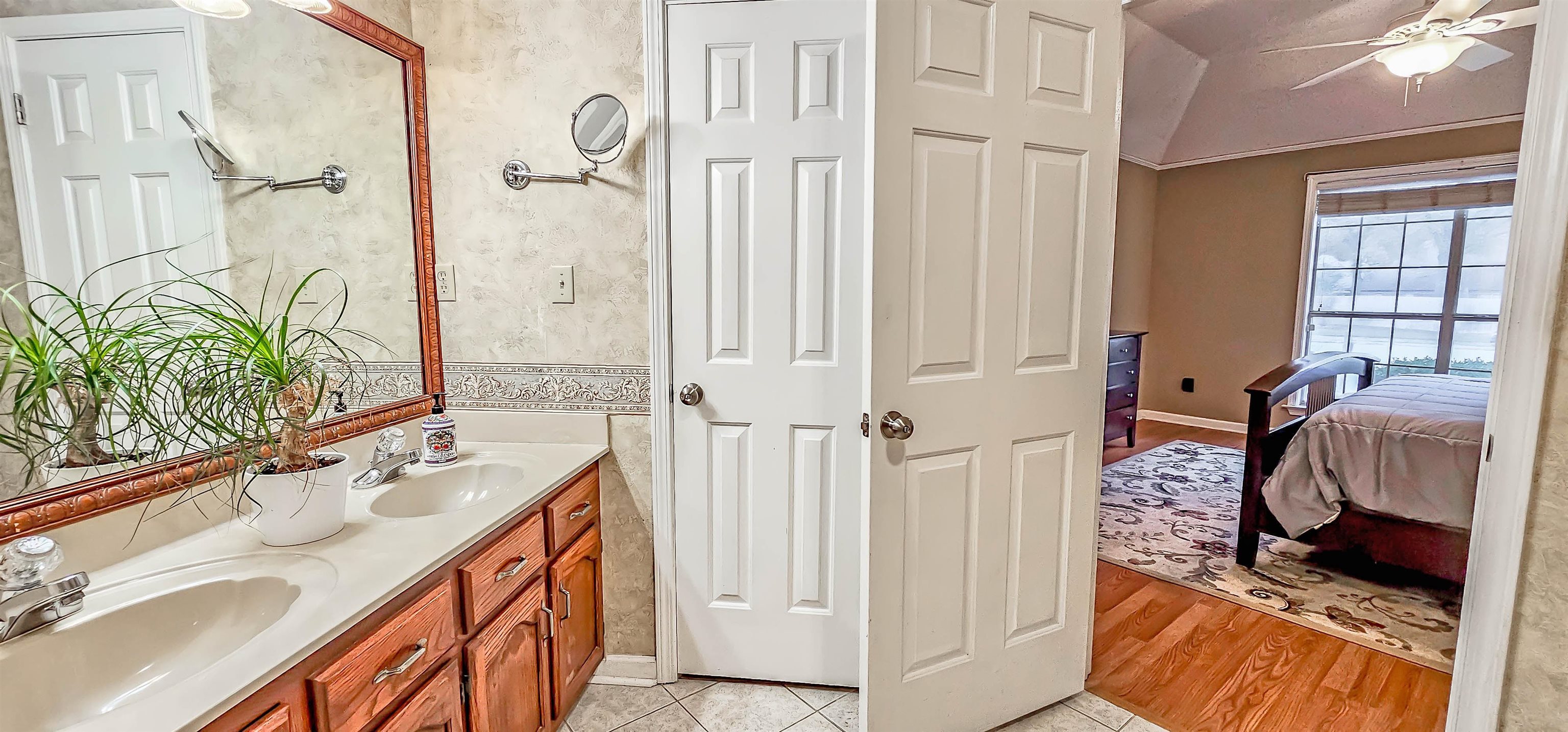 251 Summit View Cove Collierville, TN 38017 - Photo 19 of 30 a spacious bathroom with a double vanity sink a mirror and a shower