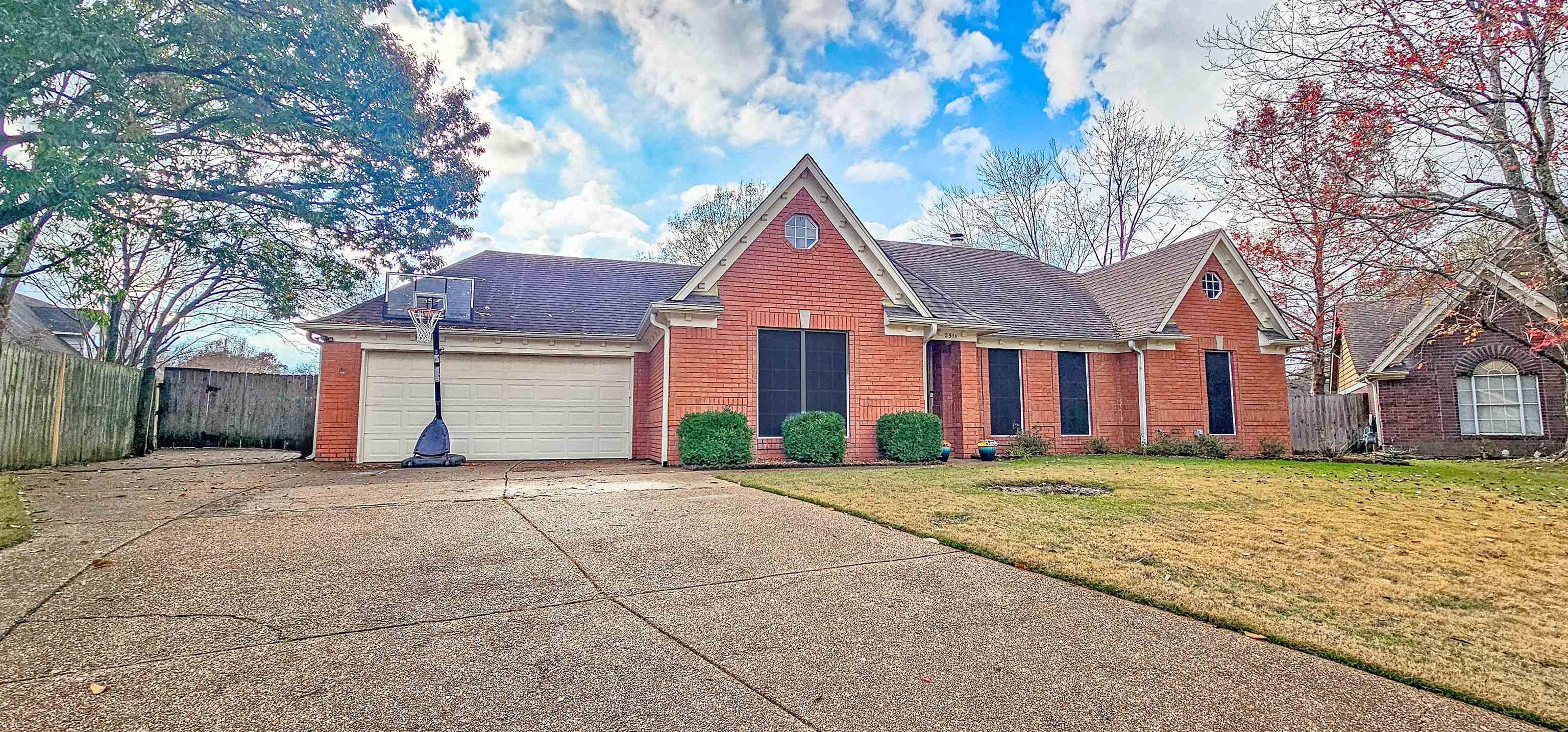 251 Summit View Cove Collierville, TN 38017 - Photo 2 of 30 a front view of a house with a yard and garage