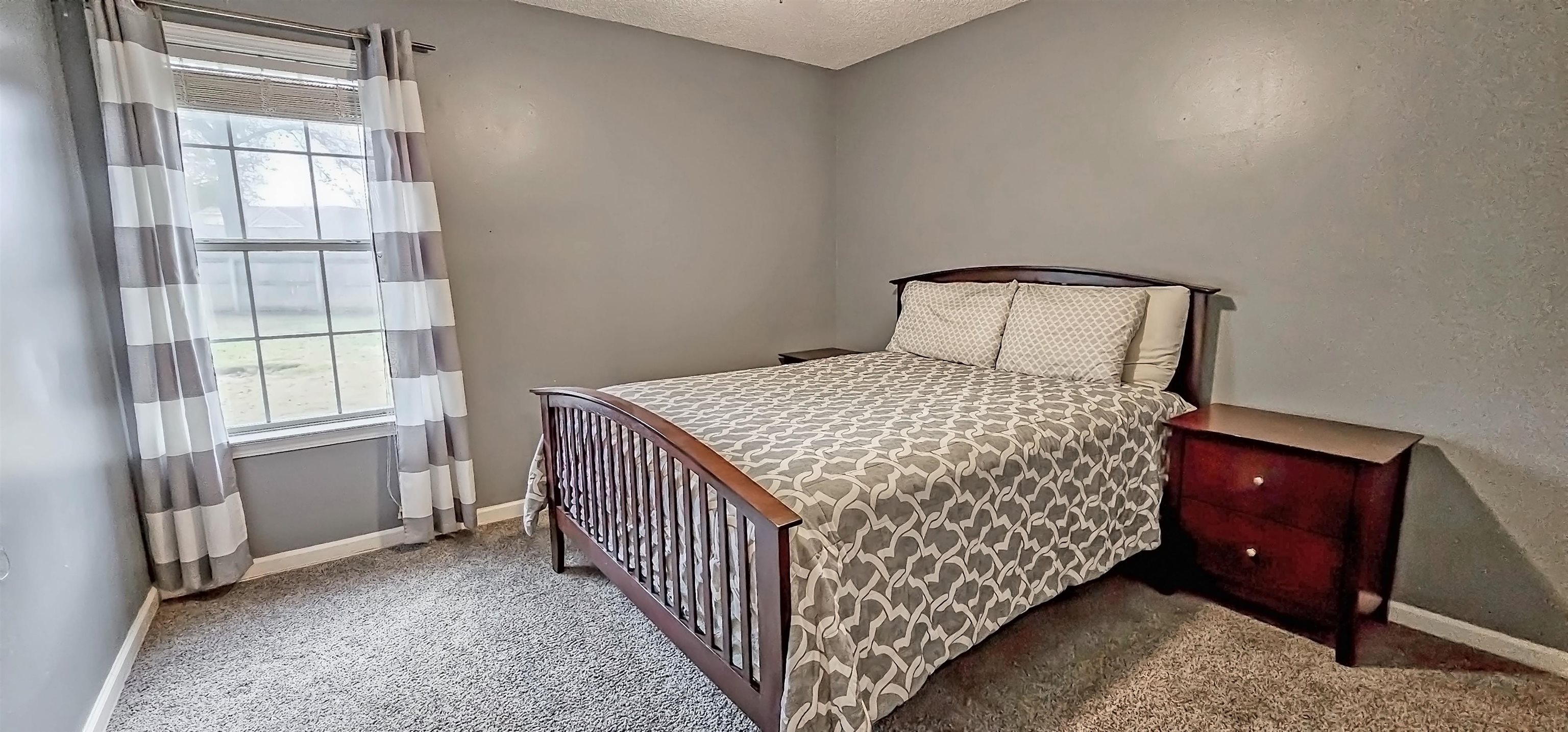 251 Summit View Cove Collierville, TN 38017 - Photo 22 of 30 a bedroom with a bed and a window