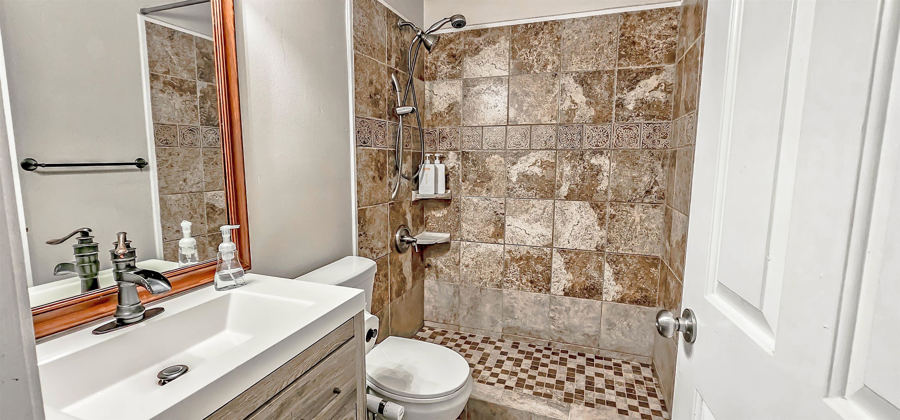 251 Summit View Cove Collierville, TN 38017 - Photo 26 of 30 a bathroom with a sink toilet and shower