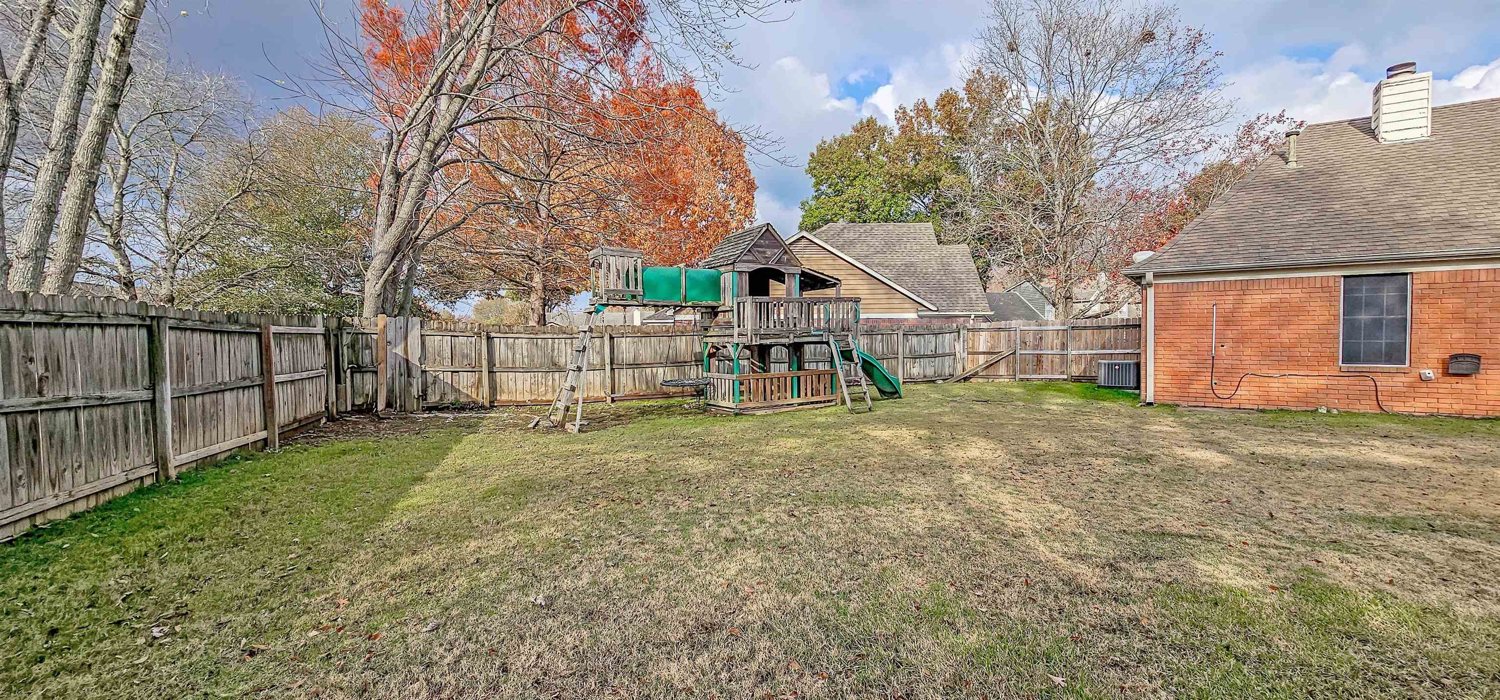 251 Summit View Cove Collierville, TN 38017 - Photo 28 of 30 a view of a yard in front of a house with a large tree