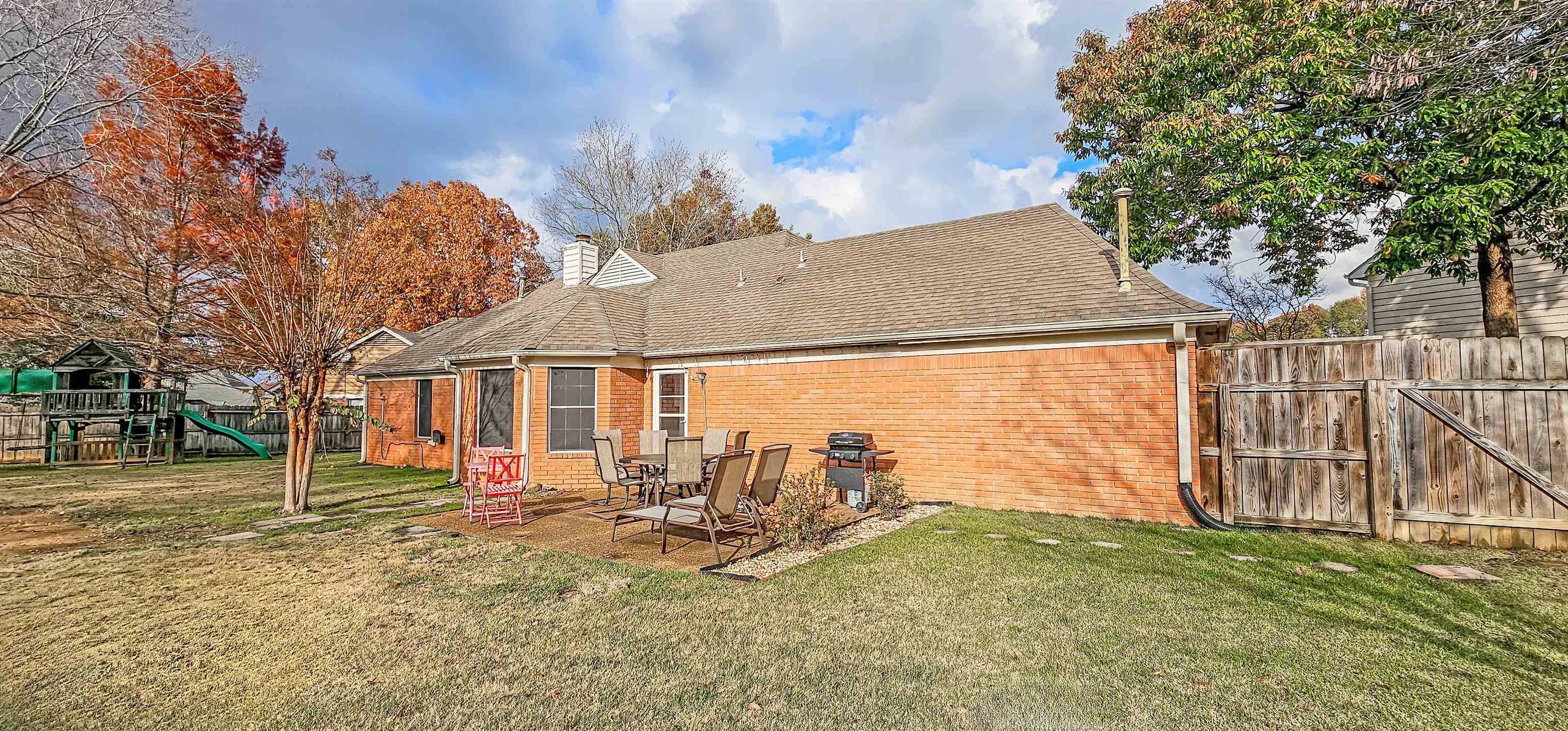 251 Summit View Cove Collierville, TN 38017 - Photo 29 of 30 a view of a house with a yard porch and sitting area