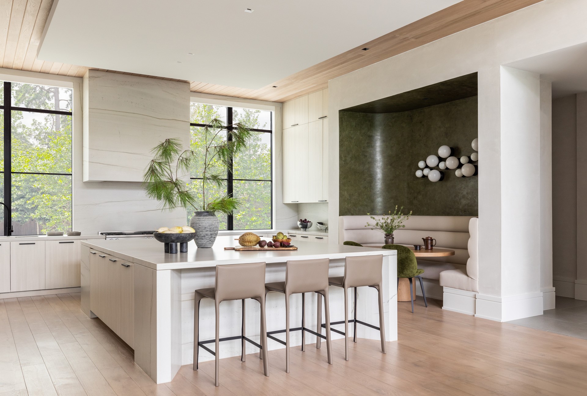 626 Rocky River Road Houston, TX 77056 - Photo 7 of 22 a view of a kitchen area with furniture and wooden floor