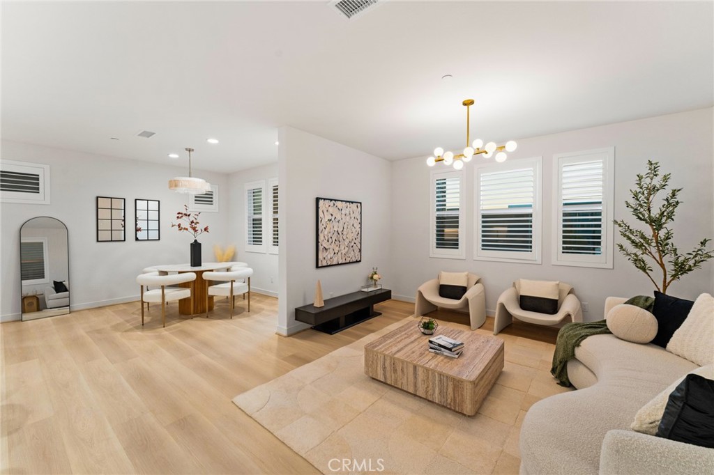 127 Restore Irvine, CA 92618 - Photo 11 of 65 a living room with furniture and a chandelier