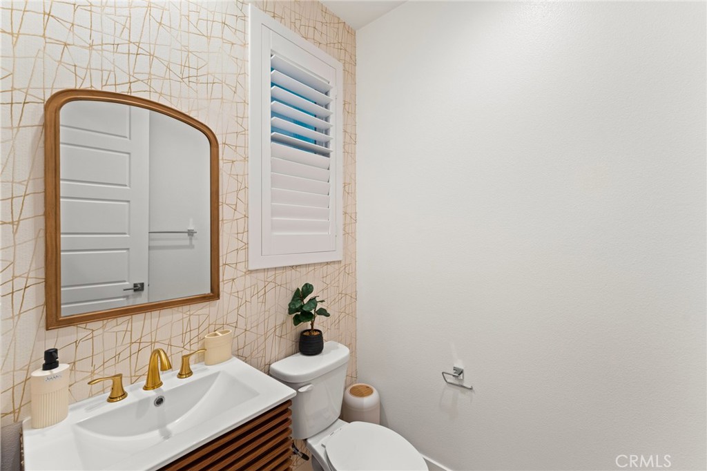 127 Restore Irvine, CA 92618 - Photo 16 of 65 a bathroom with a sink and a mirror