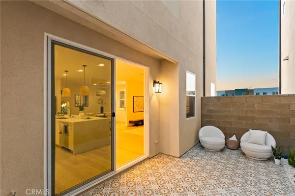 a bedroom with a large bed and a large window