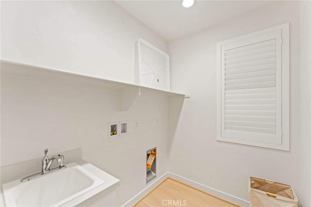 127 Restore Irvine, CA 92618 - Photo 31 of 65 a bathroom with a sink and a mirror