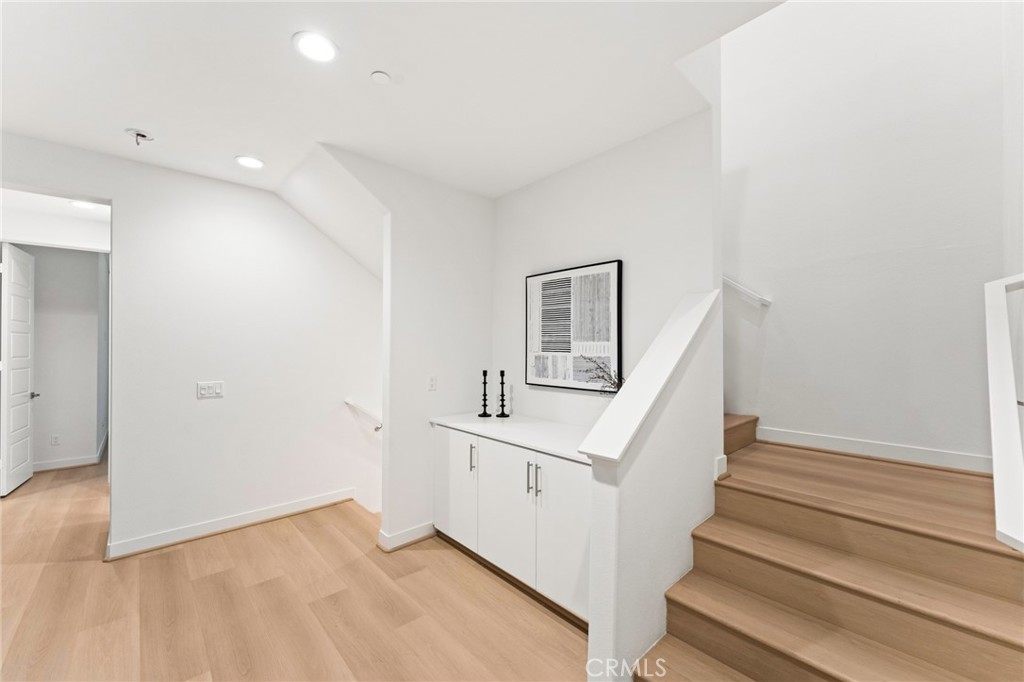 127 Restore Irvine, CA 92618 - Photo 32 of 65 a view of entryway and hall with wooden floor