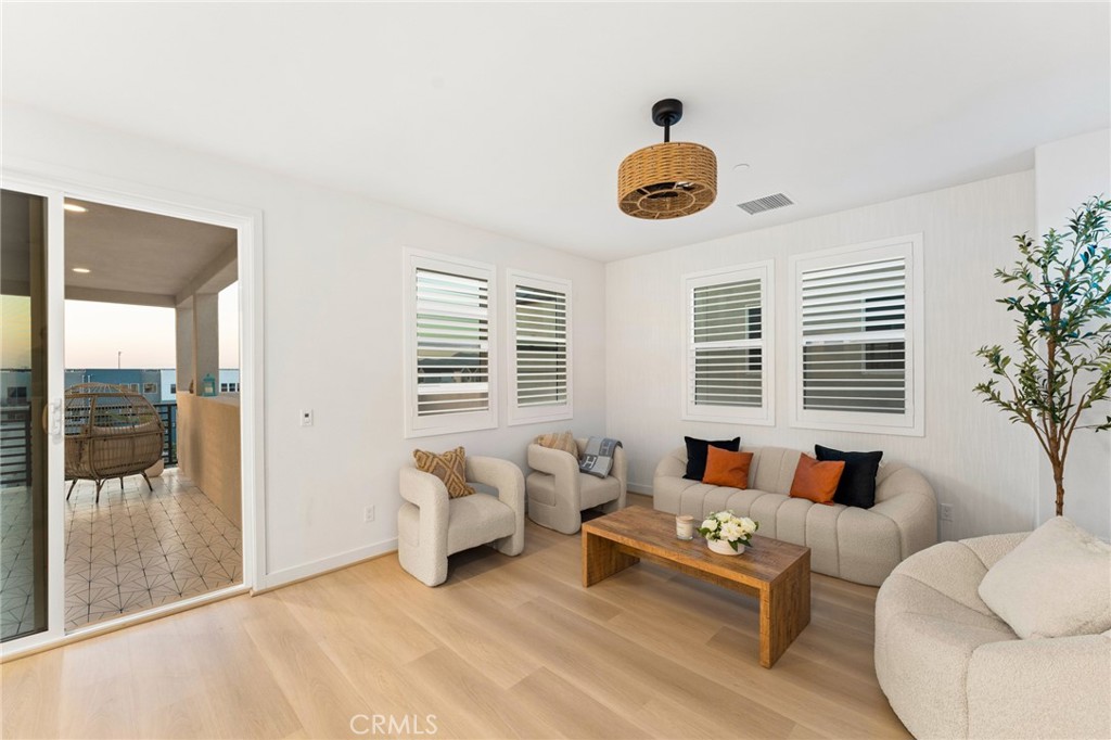 127 Restore Irvine, CA 92618 - Photo 34 of 65 a living room with furniture and a large window