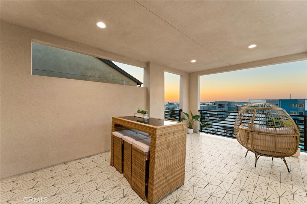 127 Restore Irvine, CA 92618 - Photo 39 of 65 a living room with furniture a flat screen tv and a floor to ceiling window