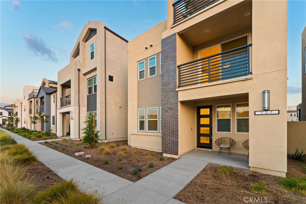127 Restore Irvine, CA 92618 - Photo 55 of 65 a front view of a building with glass windows and door