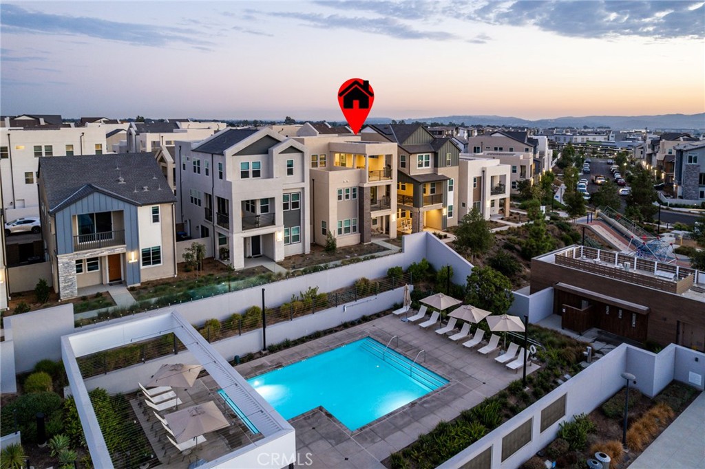 127 Restore Irvine, CA 92618 - Photo 59 of 65 an aerial view of a house with a swimming pool