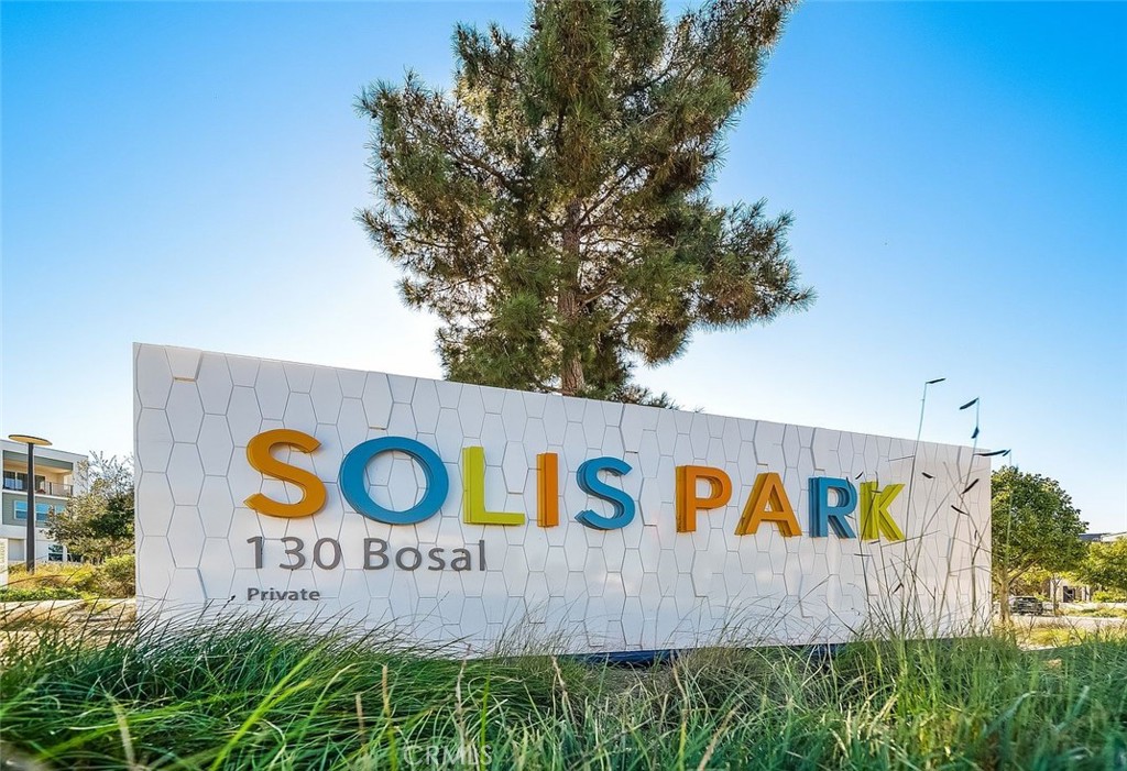 127 Restore Irvine, CA 92618 - Photo 62 of 65 a sign that is on a brick wall with a tree