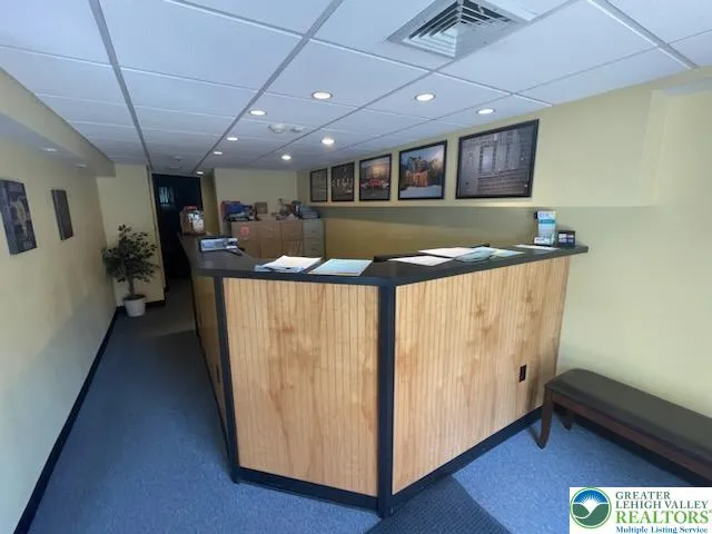 a kitchen with stainless steel appliances granite countertop a sink and a refrigerator