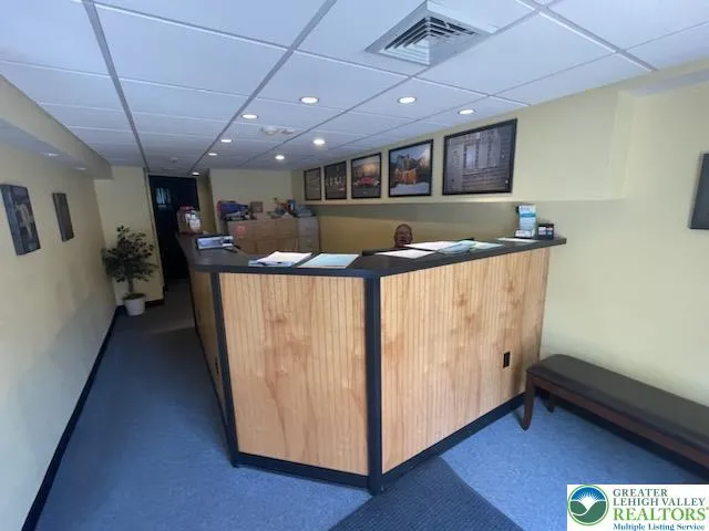 a kitchen with stainless steel appliances granite countertop a lot of counter space and wooden floors