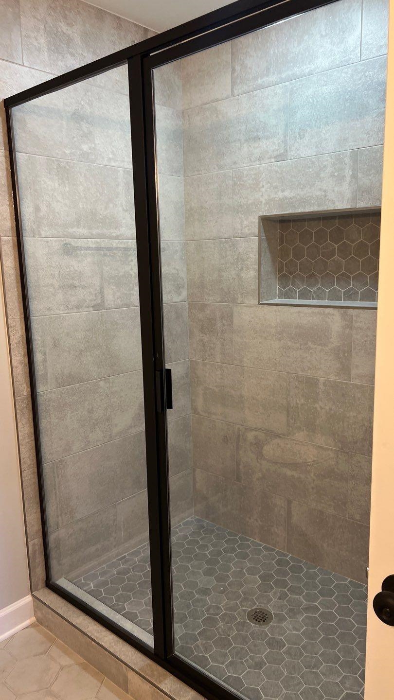 4411 Helene Road Memphis, TN 38117 - Photo 11 of 13 a bathroom with a glass shower door