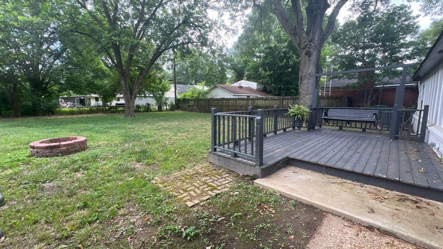4411 Helene Road Memphis, TN 38117 - Photo 12 of 13 a view of a deck with a yard chairs and a large tree