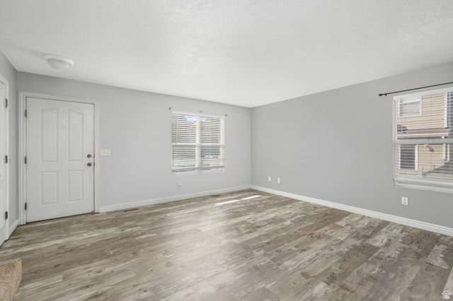 7936 Wycliffe Way Eagle Mountain, UT 84005 - Photo 5 of 37 Entrance foyer with wood finished floors and healthy amount of natural light