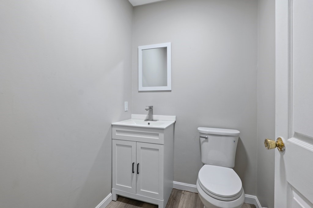 549 Main Street Townsend, MA 01474 - Photo 15 of 41 a bathroom with a toilet a sink and mirror