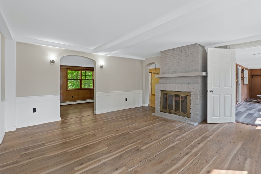 549 Main Street Townsend, MA 01474 - Photo 20 of 41 a view of a livingroom with wooden floor and a fireplace
