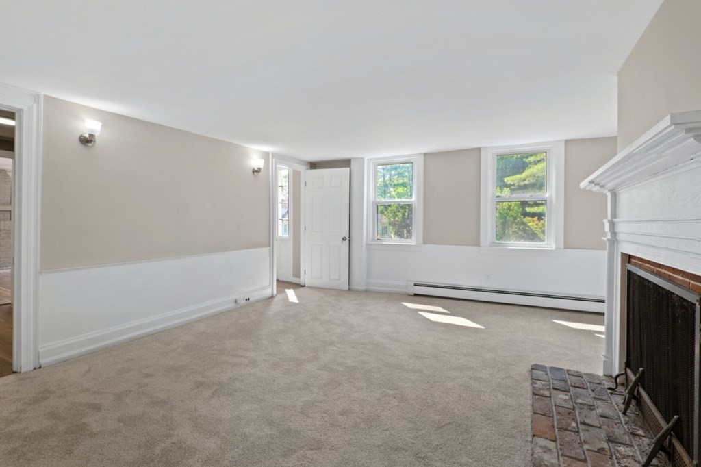 549 Main Street Townsend, MA 01474 - Photo 23 of 41 an empty room with windows and fireplace
