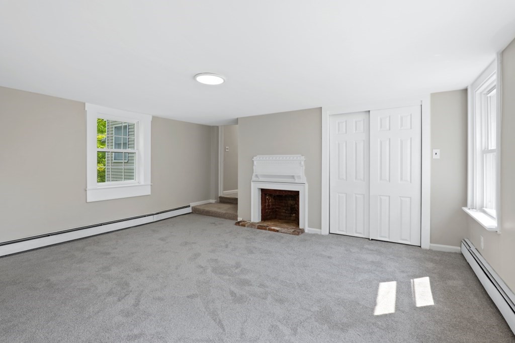 549 Main Street Townsend, MA 01474 - Photo 29 of 41 an empty room with windows and fireplace