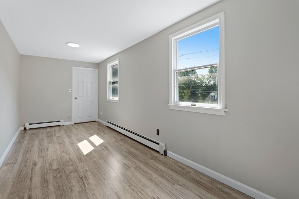549 Main Street Townsend, MA 01474 - Photo 32 of 41 an empty room with wooden floor and windows