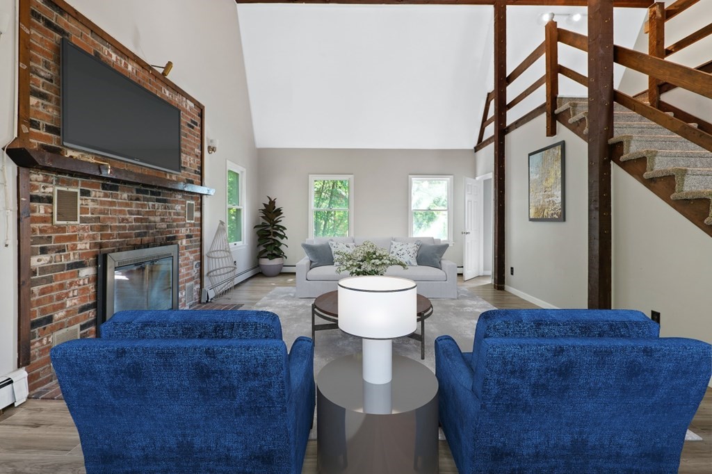 549 Main Street Townsend, MA 01474 - Photo 9 of 41 a living room with a couch and a fireplace